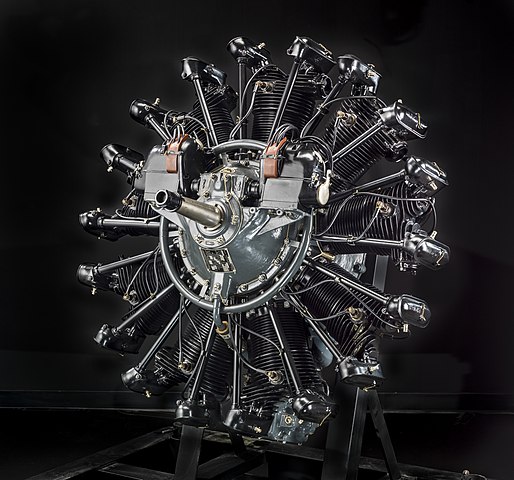 A photograph of a radial engine on a black backdrop.