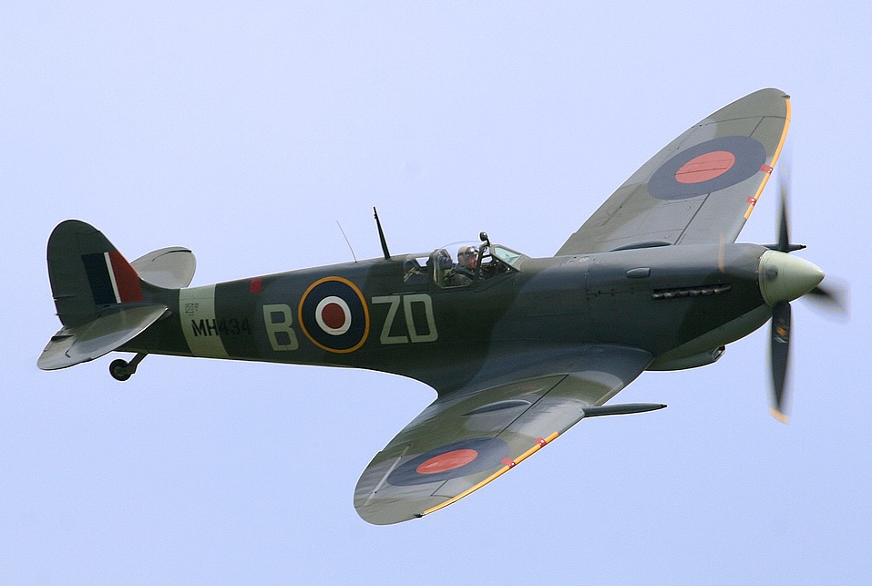 A photograph of an airplane with a propeller on the nose, and BOZD written on the fuselage.